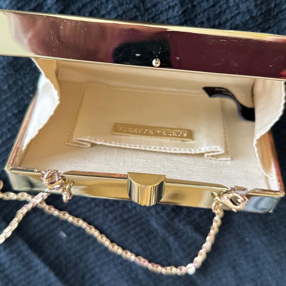 Box/minaudiere style hard clutch with gold geometric cutouts. - Picture 3 of 3